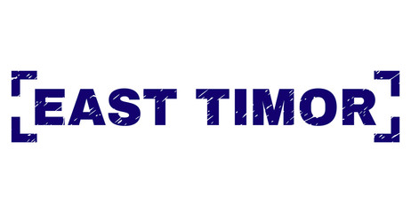 EAST TIMOR title seal print with grunge style. Text title is placed inside corners. Blue vector rubber print of EAST TIMOR with grunge texture.