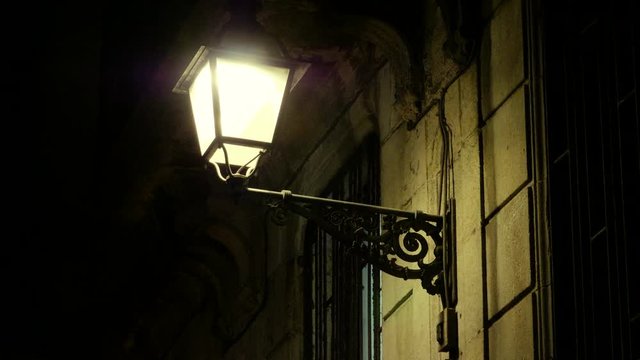 The night streets of the city. Street light with lamps in a classical style. 4K