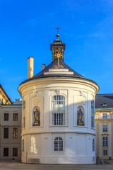 Fototapeta na wymiar Second courtyard of Prague Castle and the St Cross Chapel