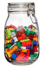 Toy building block bricks for children canned in glass jar Isolated on the white bacground