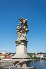 Sculpture at Charles Bridge on Vltava river in Prague, Czech Republi
