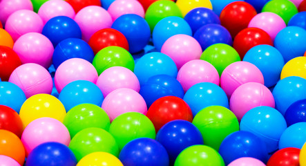 Top view of many colorful balls in ball pool at indoors playground