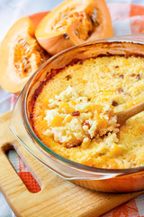 Baked milky cereal porridge with pumpkin and raisins