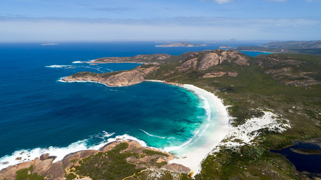 Aerial view of picturesque coastline scenery of Hellfire Bay, colorful cliffs and rocks, white sand beach and crystal clear water - Cape Le Grand, Esperance, Western Australia from above