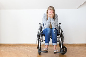 Despair young woman on wheelchair. Hard invalid concept.