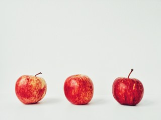 Three red apples