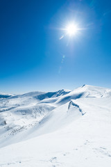 snow mountains sun