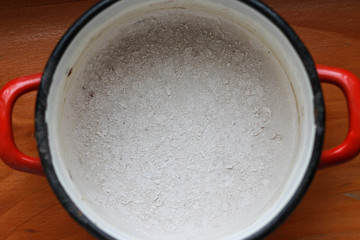 Saucepan with dry lime residue after evaporation of water