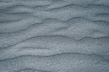 Fototapeta na wymiar Abstract texture. Background with smooth lines of sand. Ripples in the sand.