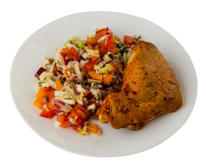 chicken wing with vegetable salad on a plate. chicken wing with vegetable salad isolated on white...