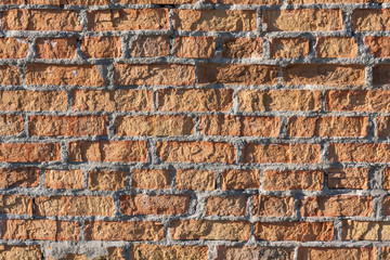 Brick wall texture background with red damaged old surface 
