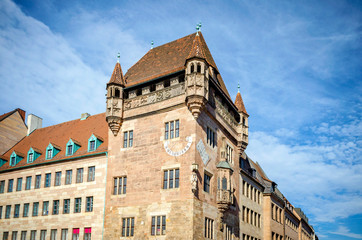 NUREMBERG: Medieval sundial on the house wall in old town of Nuremberg, Germany. Sights of Bavaria