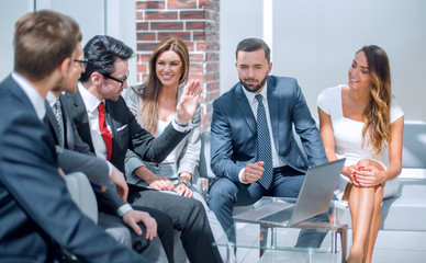 business team discussing business issues in the lobby of the business center.