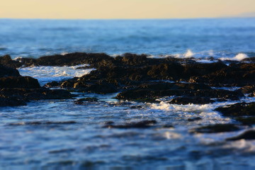 Winter beach / Ripples and waves crashing on rocks