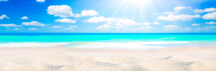 Fototapeta na wymiar Sandy Seashore With Tropical Water, Clouds And Sunshine Background