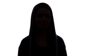 Silhouette of a girl in the hood, the symbol of anonymity