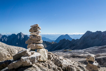 Rocks Stacked one on top of another on a mountain top (Zugspitze) in Germany &ndash; Top of the Alps