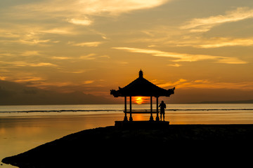 Silhouette of a small pavilion during sunrise