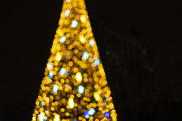 Abstract new year tree background, decorated with classical toys and illuminated with led lights