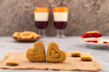 Two hearts next to baked dough. Culinary decoration for Valentine's Day. Happy love.