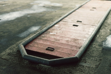 Car inspection pit with wooden caps and vintage colors