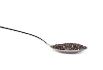 chia seeds in an iron spoon, isolated