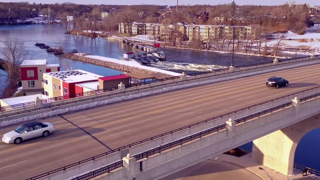 Early morning rush hour traffic on bustling city bridge, aerial view.