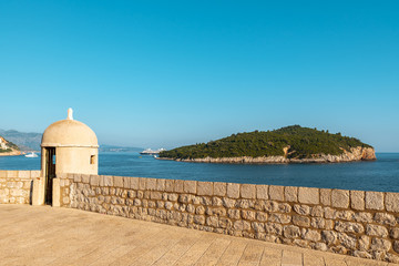 Gun turret on old city walls of Dubrovnik with Lokrum in background © Deniz