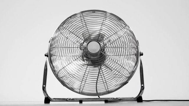 electric fan blowing air towards the camera