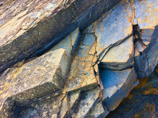 stone texture of amazing color, rocky layers of bright colors