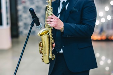 The musician plays the saxophone at the festival.