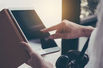 Closeup of female hands using modern digital tablet,  businesswoman working via tablet pc and...