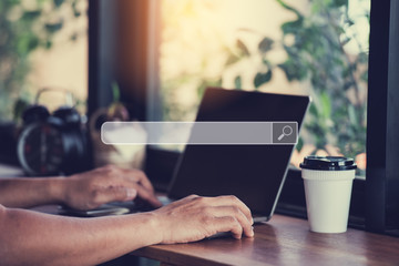Hand man using labtop for Searching Browsing Internet Data Information Networking Concept.