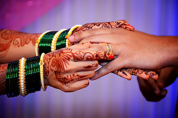 Indian wedding candid of ring ceremony