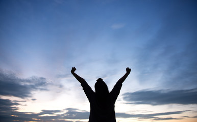 Young woman relaxing in sunset sky outdoor. People freedom style.