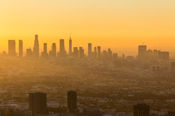 Fototapeta na wymiar Los Angeles California orange sunrise cityscape view. Shot taken hilltop in the Santa Monica Mountains. 