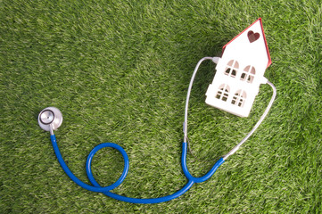 Obraz premium Medical Headphones of doctor equipment on grass background.