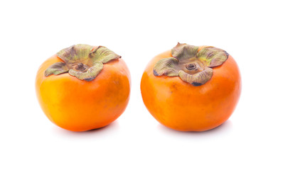 Tropical fruit persimmon. Kaki with leaves on white background