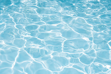 Texture of water in swimming pool for background
