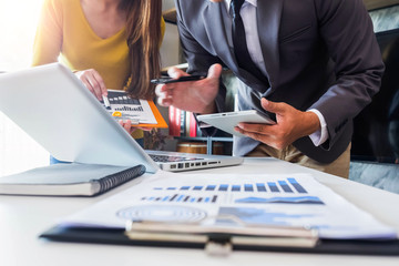 Business team present. professional investor working new start up project. Finance managers meeting.using smart phone and laptop and digital tablet computer in modern office. 