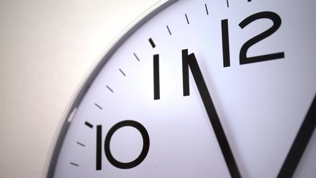 Reverse time lapse of clock with seconds, minutes and hours hands. concept of passing time. concept of time travel in the past. Close up (4k)
