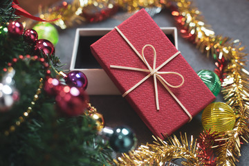Christmas and New Year's Day, Top view red gift box decorated with ribbon and ribbon and decorated christmas tree.