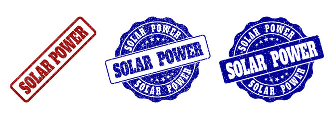 SOLAR POWER grunge stamp seals in red and blue colors. Vector SOLAR POWER overlays with scratced texture. Graphic elements are rounded rectangles, rosettes, circles and text labels.