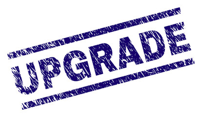 UPGRADE seal print with distress style. Blue vector rubber print of UPGRADE text with retro texture. Text label is placed between parallel lines.
