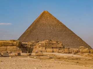 Wall of stone in front of one of the Great Pyramids in Giza