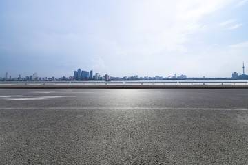 Panoramic skyline and modern business office buildings with empty road,empty concrete square floor