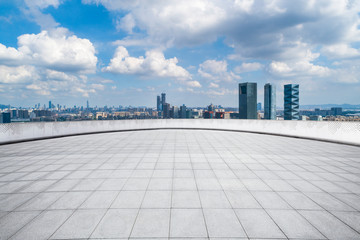 Fototapeta premium Panoramic skyline and modern business office buildings with empty road,empty concrete square floor