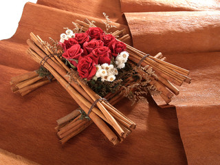 bouquet of red roses and cinnamon sticks