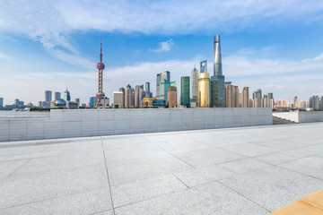 Fototapeta premium Panoramic skyline and modern business office buildings with empty road,empty concrete square floor
