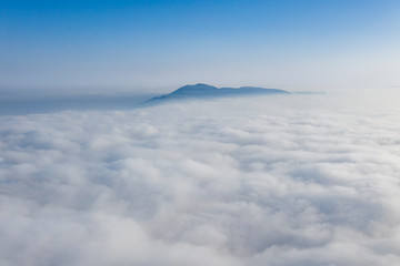 Fototapeta premium Sunrise above clouds